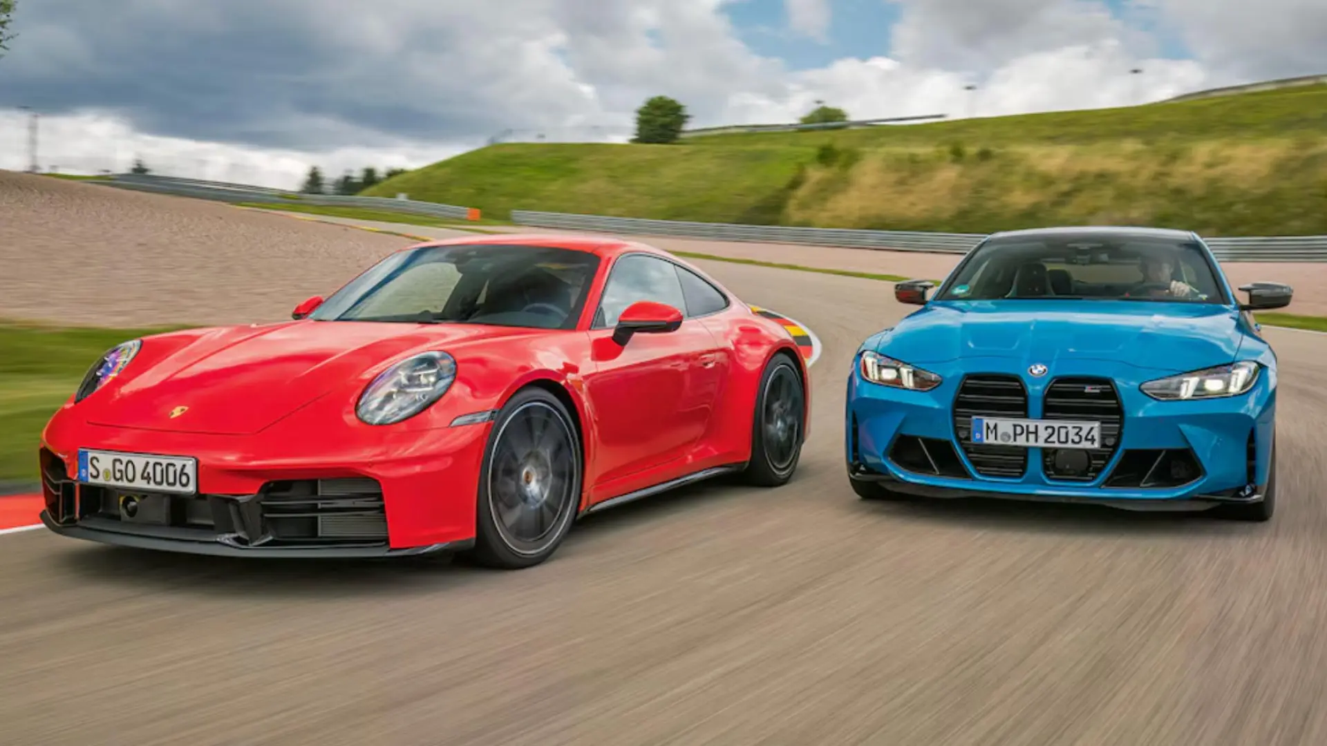 BMW M4 Competition et Porsche 911 Carrera S côte à côte sur circuit lors d'un comparatif performance